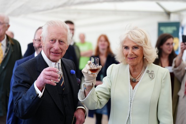 King Charles III and Queen Camilla try a glass of Duncan Taylor whisky as they attend a celebration at Edinburgh Castle to mark the 900th Anniversary of the City of Edinburgh. Picture date: Wednesday July 3, 2024. PA Photo. See PA story ROYAL Scotland. Photo credit should read: Jane Barlow/PA Wire
