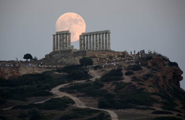 Mandatory Credit: Photo by Xinhua/Shutterstock (13995378e) The full moon rises above the Ancient Temple of Poseidon at Cape Sounion, in Sounion, Greece, on July 2, 2023. Greece Cape Sounion Temple of Poseidon Full Moon - 02 Jul 2023