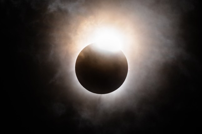 BRADY, TEXAS - APRIL 08: The moon begins its descent below the sun's horizon during a total solar eclipse on April 08, 2024 in Brady, Texas. Millions of people have flocked to areas across North America that are in the "path of totality" in order to experience the eclipse today. During the event, the moon will pass in between the Sun and the Earth, appearing to block the Sun. (Photo by Brandon Bell/Getty Images)